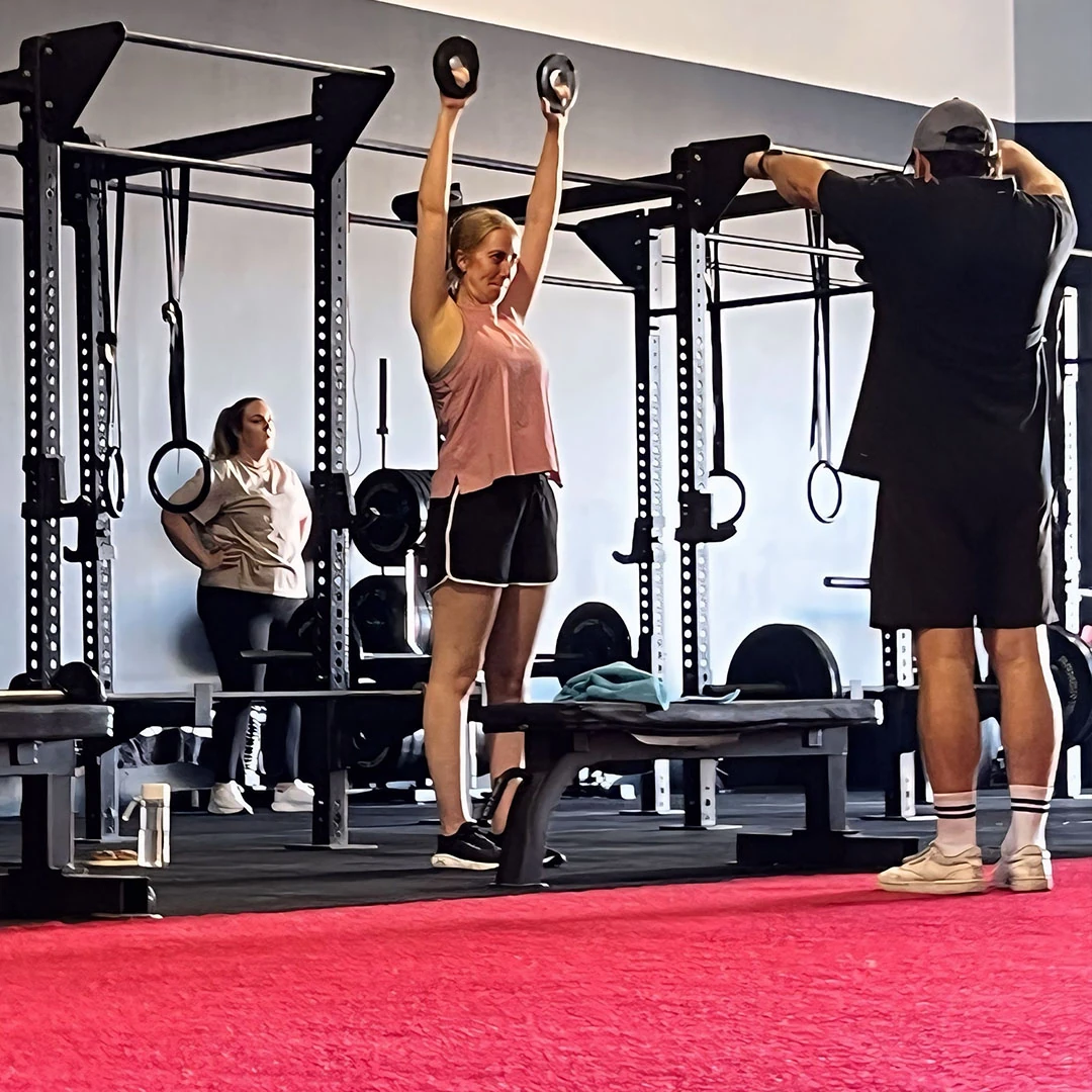 Training with a coach on the LX gym floor